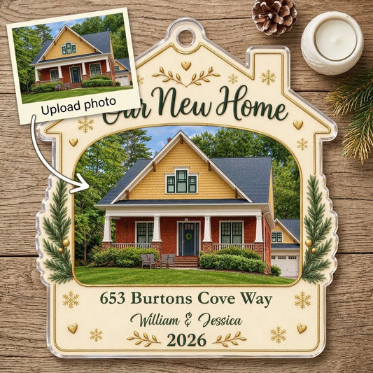 House-shaped acrylic ornament with “Our New Home”, a house photo frame, pine boughs, gold hearts and snowflakes.
