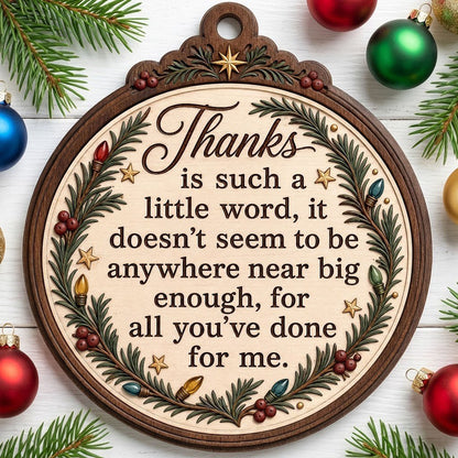 Wood ornament with arched top, pine branches, colorful lights, red berries, gold stars, and a heartfelt thank-you quote.