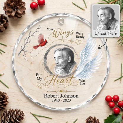 Round glass ornament with a sketch portrait frame, blue angel wing, red cardinal and 'Your Wings Were Ready' memorial te