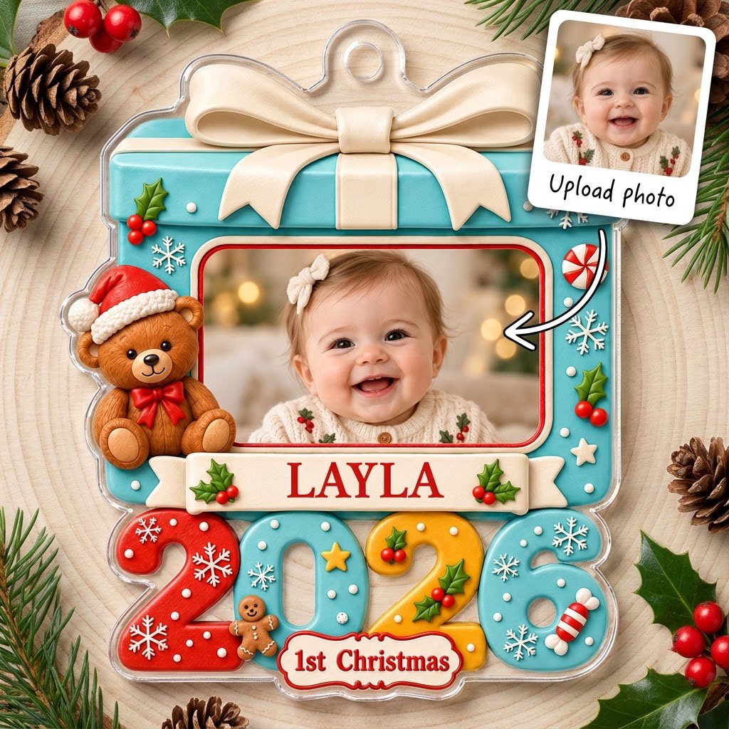 Light blue gift-box photo ornament with cream bow, teddy bear, red trim, and colorful 2026 base with 1st Christmas.