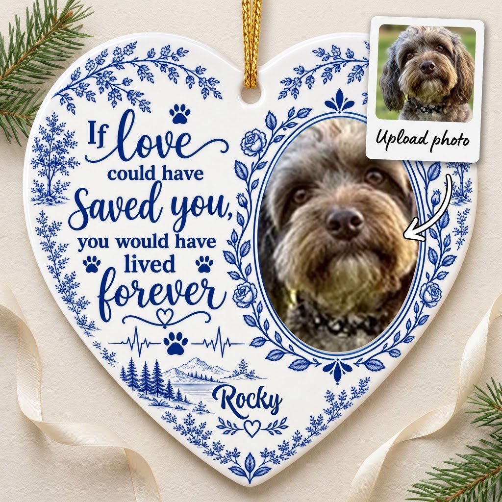 White heart ceramic ornament with blue dog photo frame wreath, memorial quote, paw heartbeat, and a mountain lake scene.