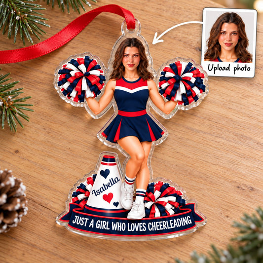 Custom-cut acrylic ornament of a cheerleader in red, navy and white with pom-poms, a megaphone and a name banner.