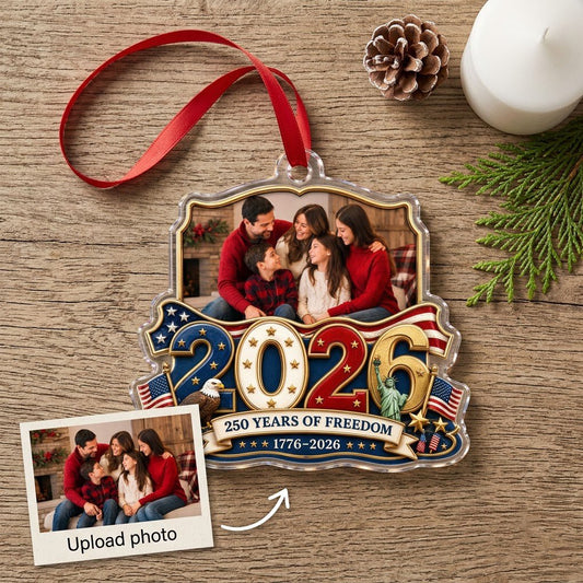 Custom-cut acrylic ornament with '2026', eagle, Statue of Liberty, flags and a gold photo frame.