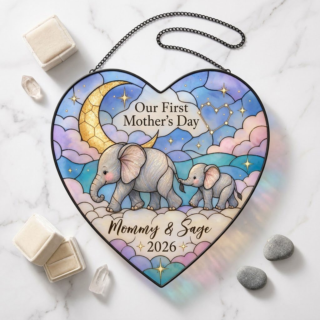 Heart stained-glass suncatcher with mom and baby elephants, crescent moon, pastel clouds, and gold stars.