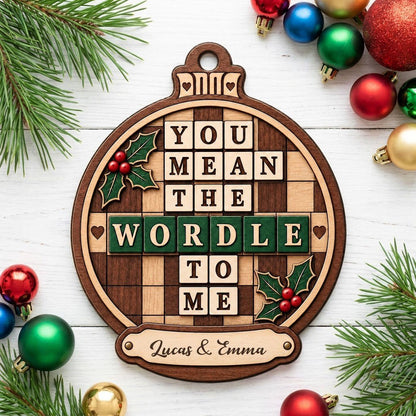 Bauble wood ornament with 'You Mean The Wordle To Me', green WORDLE tiles, holly and personalized names