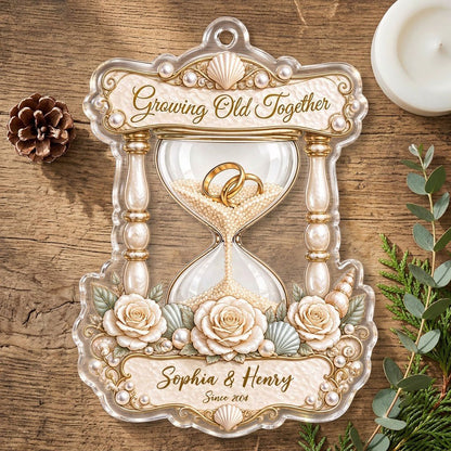 Acrylic hourglass ornament with gold rings, roses, seashells, pearls, and Growing Old Together text.