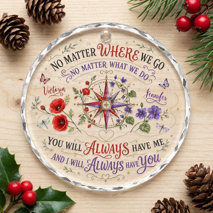 Round glass ornament with a compass rose, red and purple flowers, butterflies, dragonflies, and long-distance quotes.