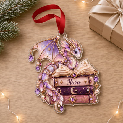 Pastel purple and gold dragon on an open book atop stacked books with jewels and pearls on a clear acrylic ornament.
