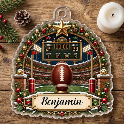 Acrylic ornament with football on a tee, stadium scoreboard, and pine garland border with a name banner.