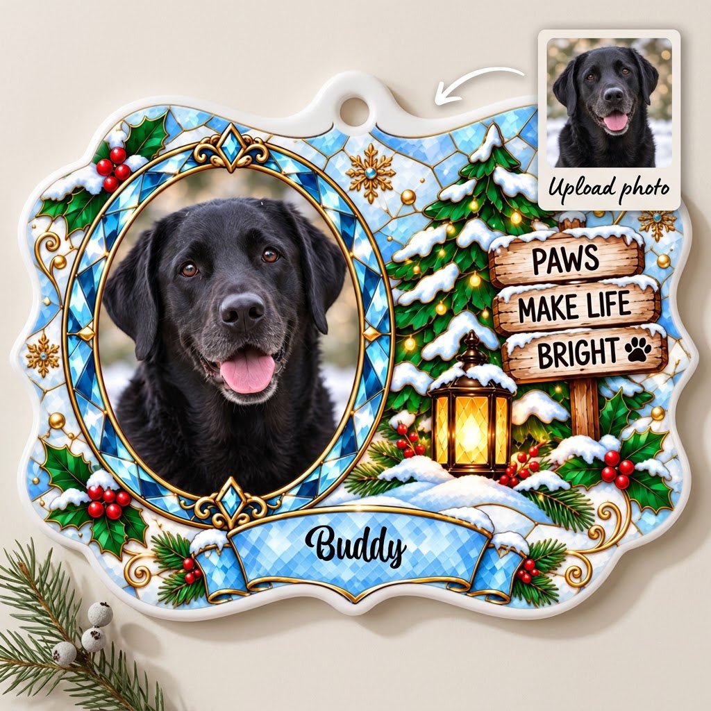Scalloped ceramic medallion ornament with dog photo, blue stained glass frame, lantern, and Christmas tree in snow.