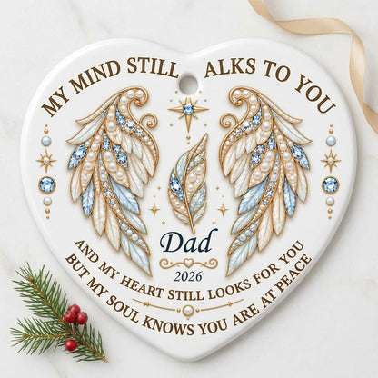 White heart ceramic ornament with jeweled angel wings, blue gems, gold scrollwork, personalized name and year.
