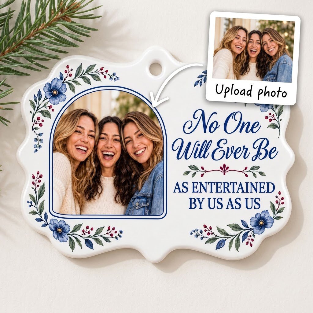 Blue floral ceramic ornament with navy photo frame and the text No One Will Ever Be As Entertained By Us As Us.