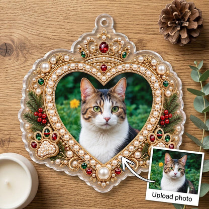 Acrylic ornament with a cat photo framed by gold filigree, jeweled crown, faux pearls, holly and paw prints on an ornate