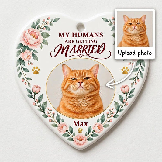 Heart ceramic ornament with 'My Humans Are Getting Married,' a cat photo, pink florals, gold paw prints, and a heart ico