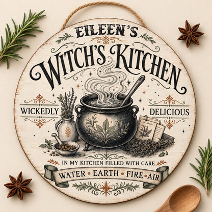 Round wooden hanging sign with a bubbling cauldron, herbs, spellbook, stars and the words Witch's Kitchen.