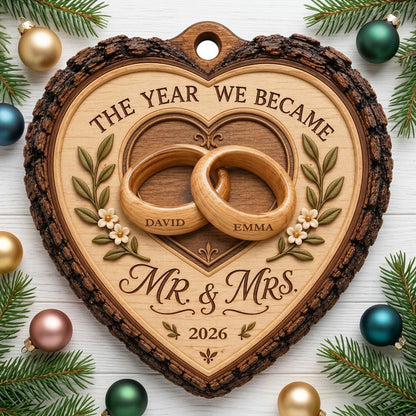 Heart-shaped wood ornament with bark edge, wedding rings, leafy vines, and 'THE YEAR WE BECAME MR. & MRS.' text.
