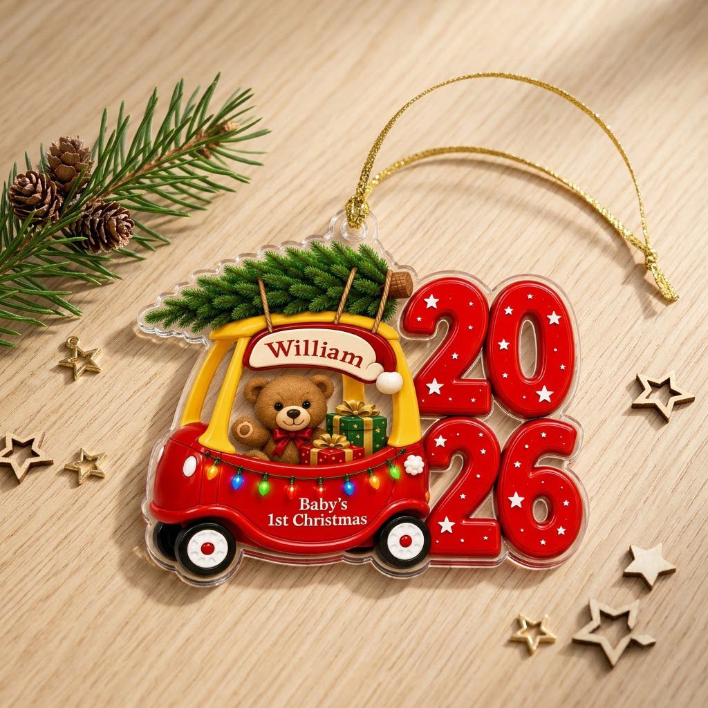 Red toy car with pine tree, teddy bear and gifts, "Baby's 1st Christmas" and 2026 star-pattern numbers on clear acrylic.