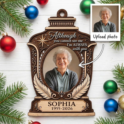 Lantern-shaped memorial wood ornament with oval photo, two feathers, starburst, fleur-de-lis and scrollwork accents.