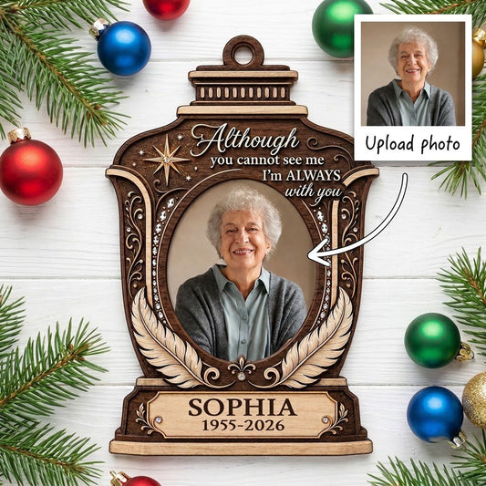 Lantern-shaped memorial wood ornament with oval photo, two feathers, starburst, fleur-de-lis and scrollwork accents.