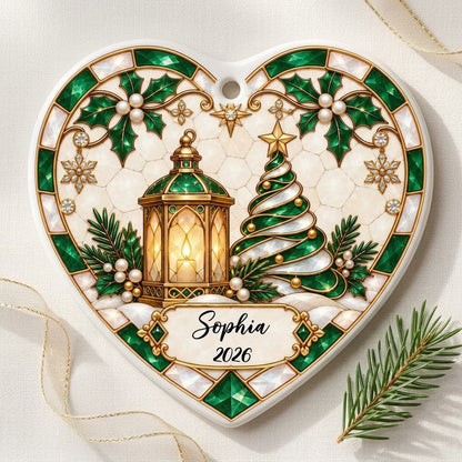 Heart ornament with emerald stained-glass border, gold lantern, spiral tree, holly, and a name-and-year scroll plaque.