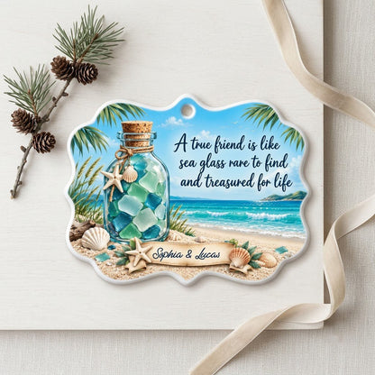 Ornate medallion ceramic ornament with sea glass jar, beach scene, palm branches and a friendship quote for two names.