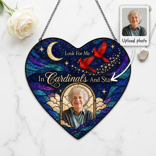 Heart-shaped stained glass suncatcher with night sky, moon, stars, two red cardinals, and a golden photo frame.