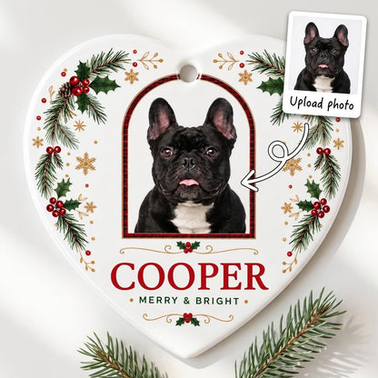 Heart ceramic ornament with dog photo in red-green plaid arch, holly, pine, gold snowflakes, and MERRY & BRIGHT text.