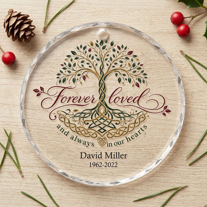Round glass ornament with Celtic Tree of Life in green, gold and red, reading Forever loved and always in our hearts.