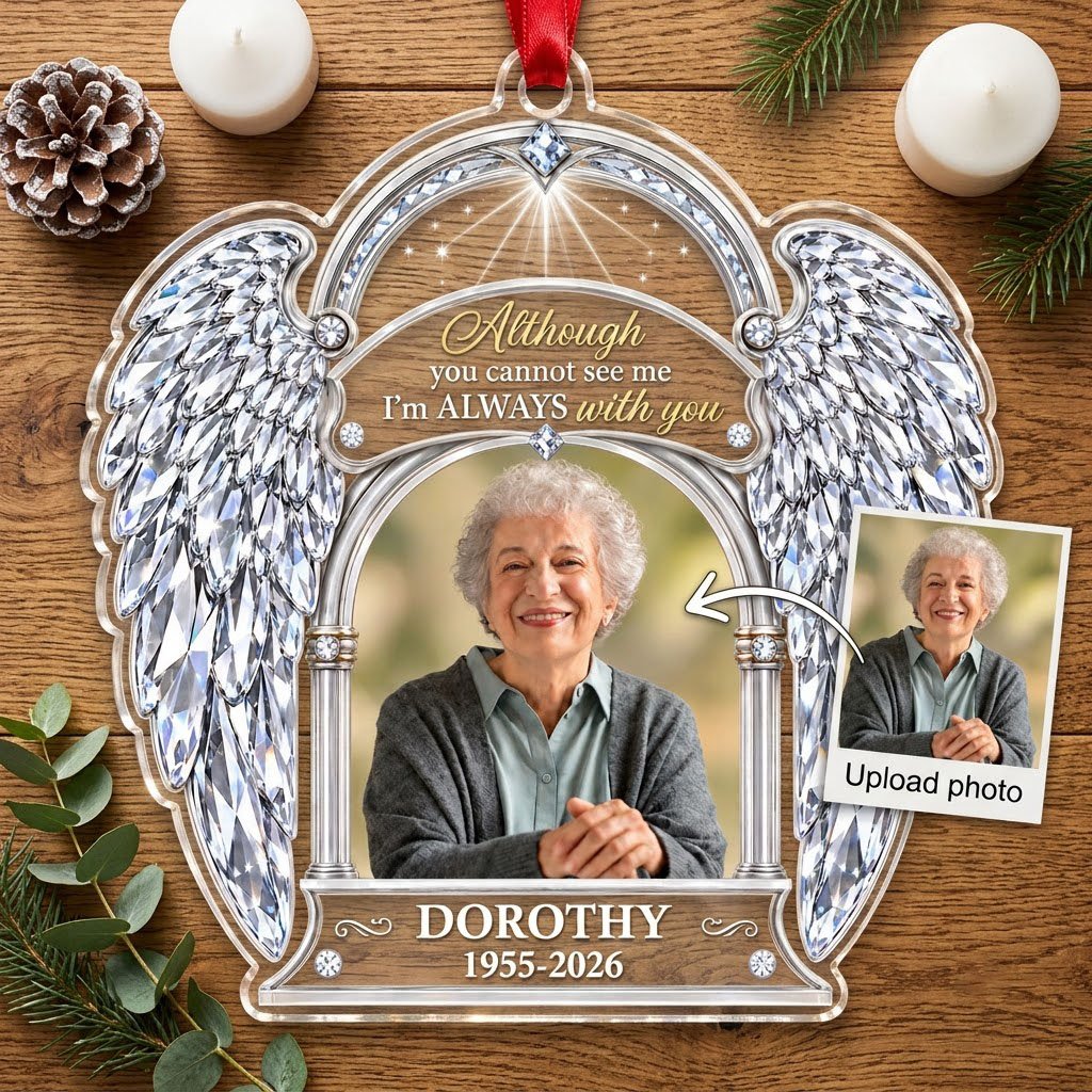 Acrylic memorial ornament with crystal angel wings, arched photo frame and wood-grain name and date banners.