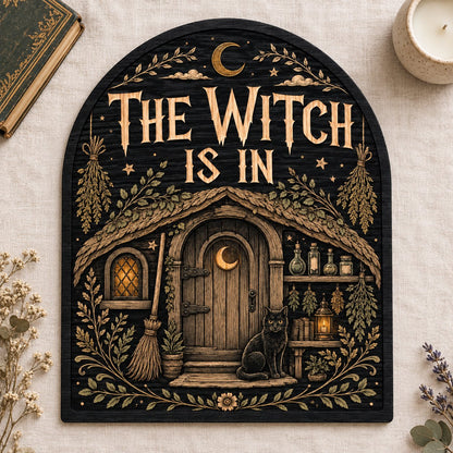 Arch wood sign with "THE WITCH IS IN", witch cottage, black cat, broom, herbs and lantern details.
