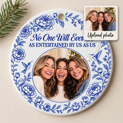 Round white ceramic ornament with blue floral border, two hummingbirds and a central circular photo frame with friends.