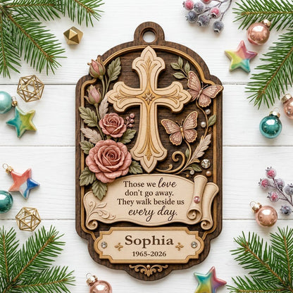Ornate arch wood ornament with carved cross, roses, butterflies and memorial quote with name and dates.