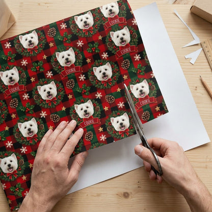 Red and green plaid wrapping paper with Westie in wreaths, snowflakes, stars, holly, and a name on red banners.