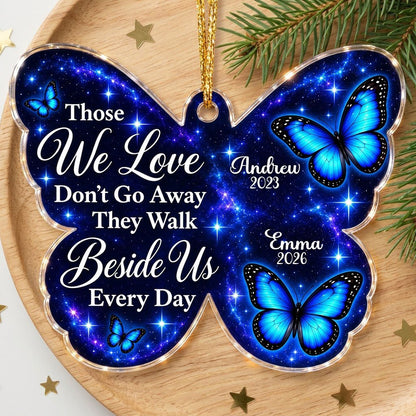 Butterfly-shaped ornament with blue butterflies and a galaxy background, reading Those We Love Don't Go Away.