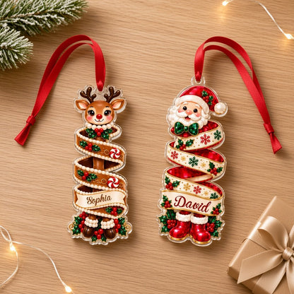Custom-cut acrylic ornament showing a reindeer or Santa head wrapped in a name banner with holly and candies.