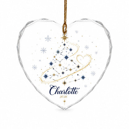 Heart-shaped stained glass suncatcher with a starry Christmas tree, gold ribbon heart, and snowflakes.