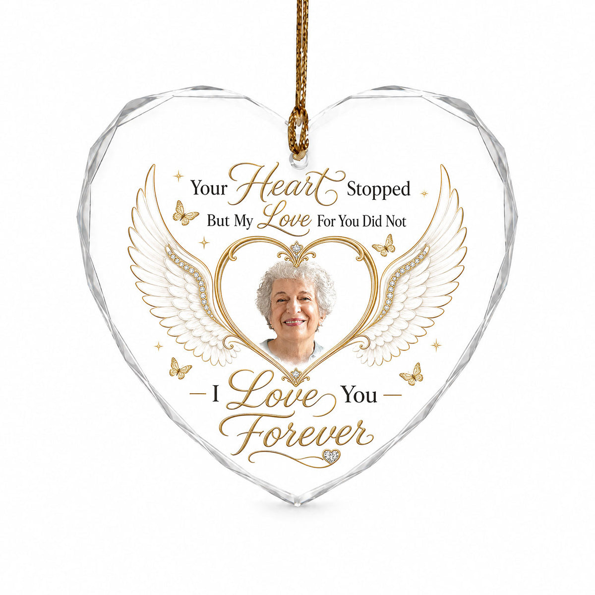 Heart-shaped glass ornament with white angel wings, gold heart photo frame, golden butterflies and sparkles.