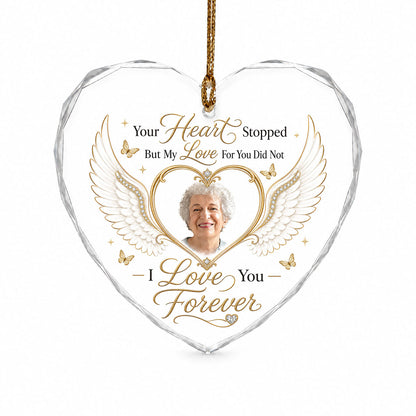 Heart-shaped glass ornament with white angel wings, gold heart photo frame, golden butterflies and sparkles.