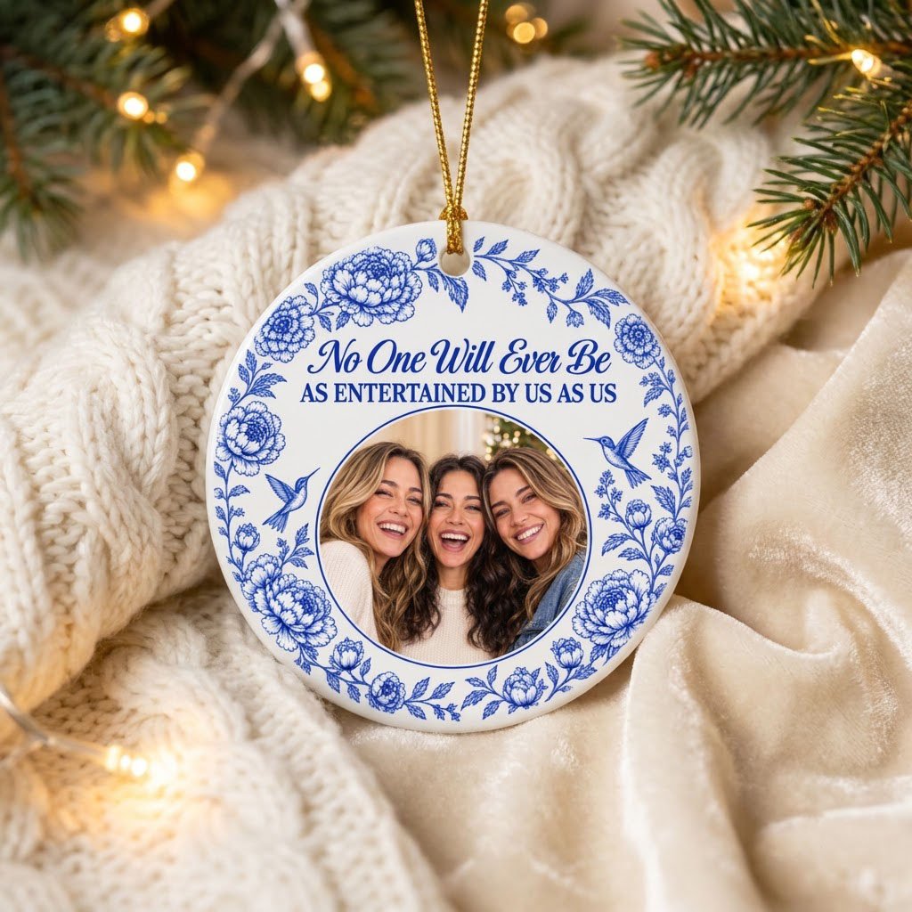 Round white ceramic ornament with blue floral border, two hummingbirds and a central circular photo frame with friends.