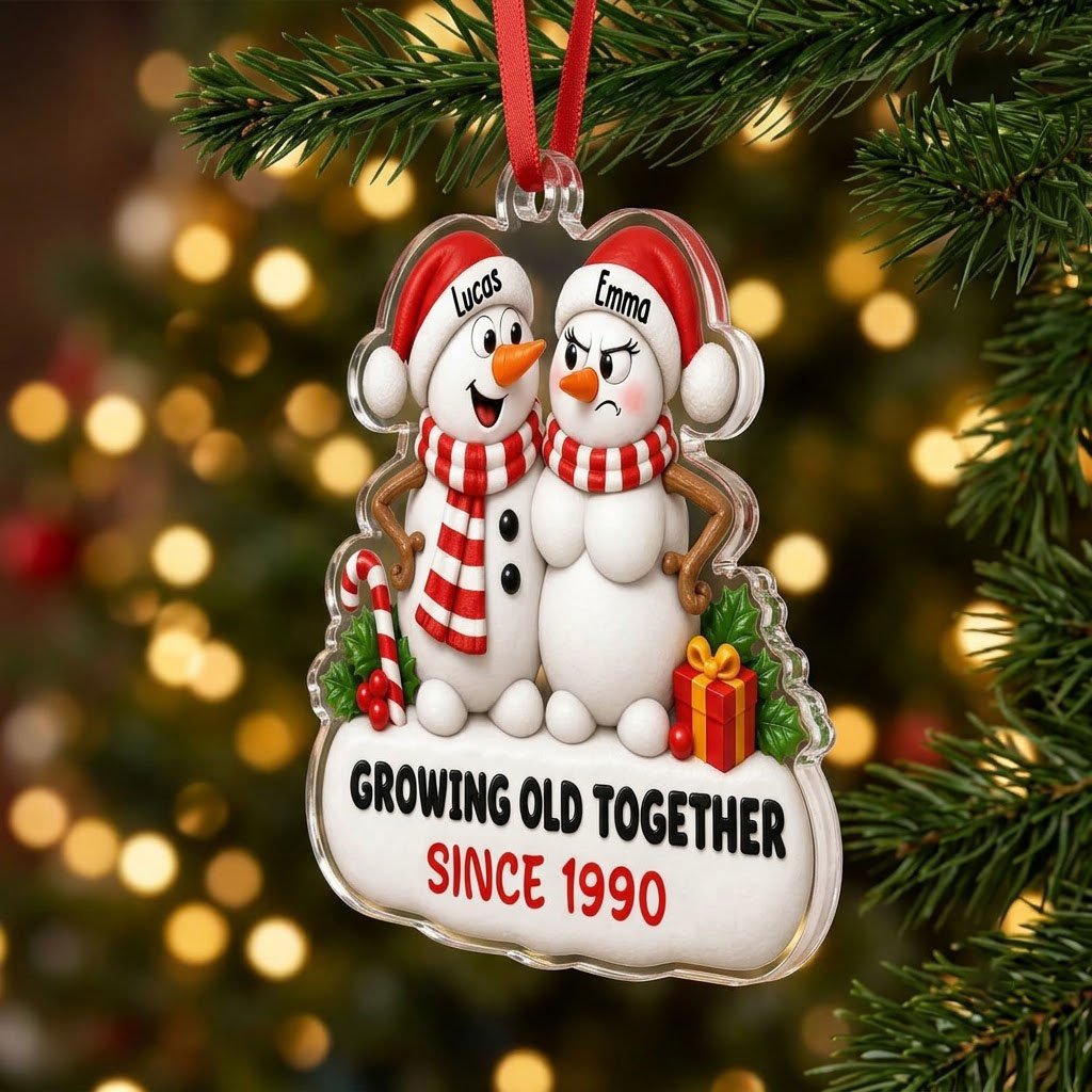 Custom-cut acrylic ornament of a snowman couple with candy cane, gift box, and Growing Old Together text on a snowy base