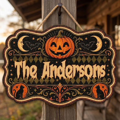 Ornate scalloped wooden sign with jack-o'-lantern, moons, bats, black cats and family name in Halloween style.