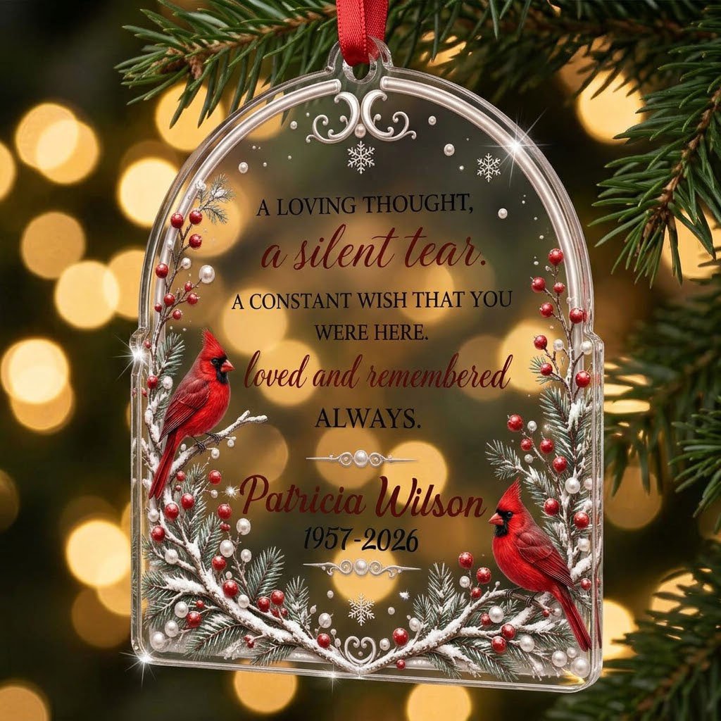 Clear acrylic arch ornament with two red cardinals, snowy evergreens, memorial verse, plus personalized name and dates.