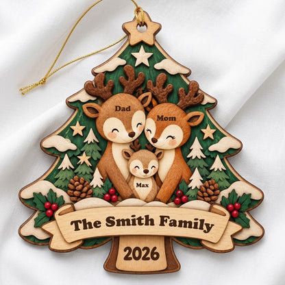 Tree-shaped wood ornament with a deer family, star topper, holly, pinecones, and personalized names and year.