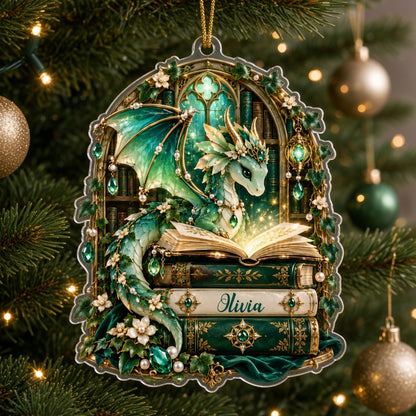 Emerald green dragon with gold-accented wings on vintage books, name Olivia, stained-glass arch acrylic ornament.