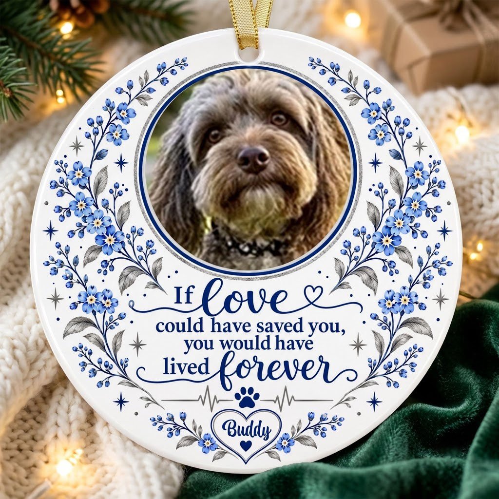 Round ceramic ornament with pet photo, blue forget-me-not florals, paw heartbeat line, and memorial quote.