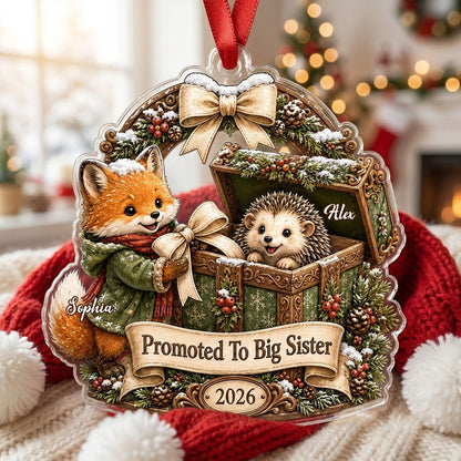 Custom-cut acrylic ornament: fox in jacket, hedgehog in box, pine arch and Promoted To Big Sister banner.
