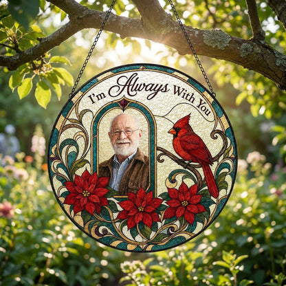 Round stained-glass style suncatcher with arched photo window, red cardinal, three red poinsettias and the words I'm Alw