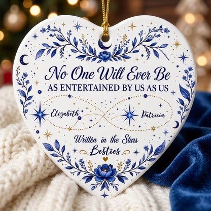 White heart ceramic ornament with blue florals, moons, stars, and “Written in the Stars Besties” with two names.