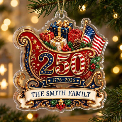 Acrylic ornament shaped like a Santa sleigh with '250', '1776-2026', US flag and a family name banner.