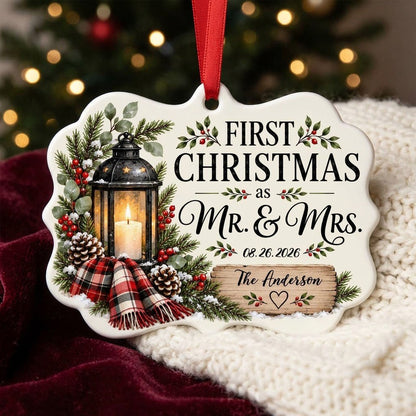 Medallion ceramic ornament with black lantern, pine, red berries, plaid scarf, and 'FIRST CHRISTMAS as MR. & MRS.' text.